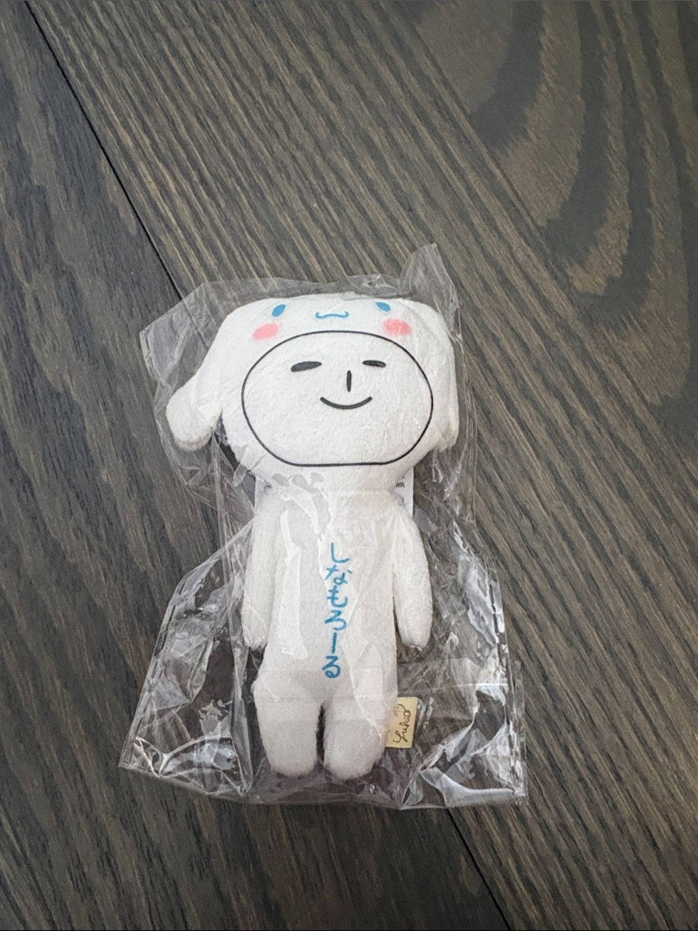 Sanrio White Plush Character with Pink Cheeks and Blue Accents